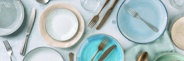 modern dinnerware panorama with cutlery and various dishes, overhead shot - pôr a mesa imagens e fotografias de stock