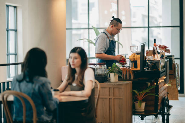 istock cafe owner preparing coffee at counter 1353424006