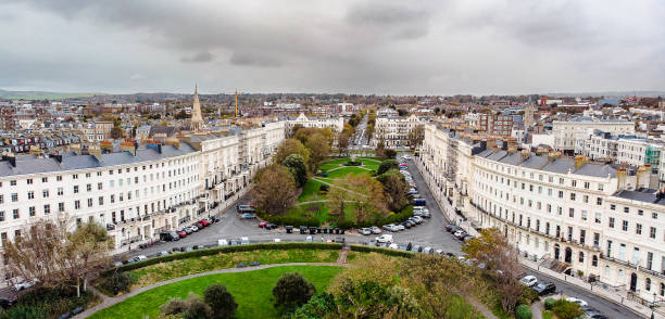 Aerial view of architecture in Brighton, UK Aerial view taken by drone depicting the architecture of the English coastal city of Brighton, including regency-style residential buildings. regency style stock pictures, royalty-free photos & images
