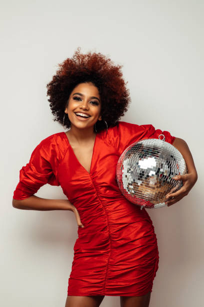 istock Beautiful smiling girl with curly hairstyle 1353428331