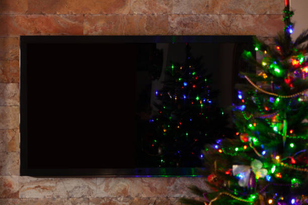 istock Big TV in room with Christmas tree 1353431028