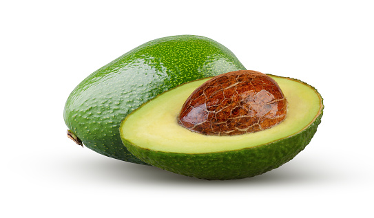 Half and whole avocados isolated on white background. Excellent retouching and full depth of field.