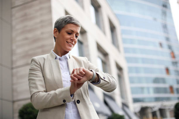 istock Businesswoman checking the time 1353431690