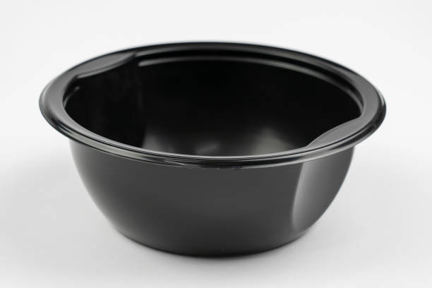 istock Empty black plastic dish for food isolated on grey background 1353433294