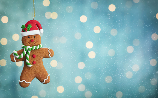 Holiday Background with Cute Christmas Gingerbread Man and Bokeh