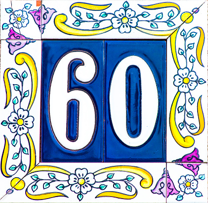 The decorated house number 60 at a house entrance