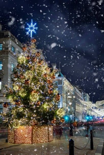 The decorated city center of London for Christmas The decorated city center of London for Christmas time with snow falling, England winter wonderland london stock pictures, royalty-free photos & images