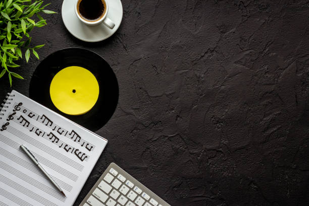 istock Musicians desk music recording with music sheets 1353433725