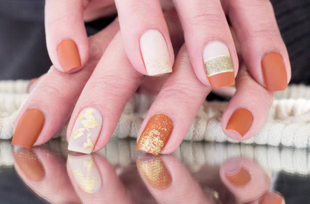 istock Autumn Leaves Nail Art Design 1353434608