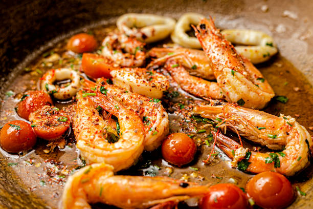 Making Gambas Aglio On Pan Shrimps stock photo