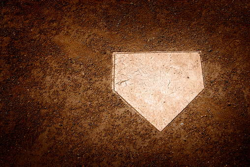 Home plate in dirt on baseball field or diamond for scoring