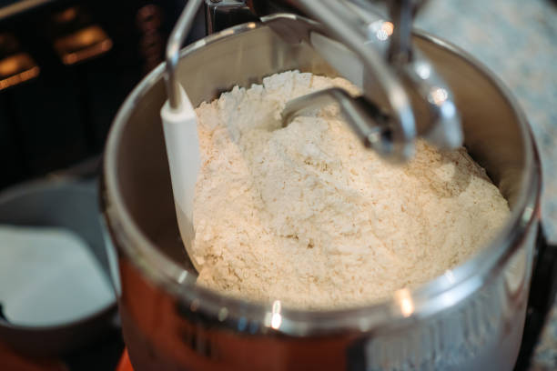 istock Bread stand mixer machine working with flour in kitchen 1353438391
