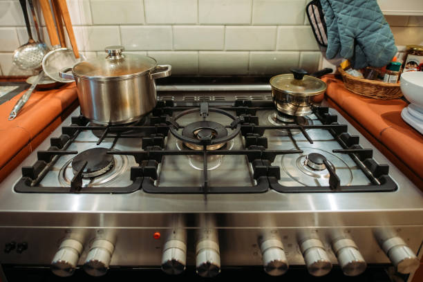 istock Gas stove burners in kitchen 1353438402