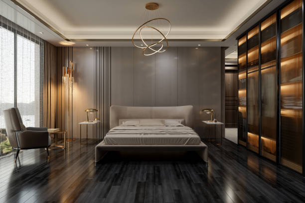 eleganckie wnętrze sypialni z podwójnym łóżkiem, stolikami nocnymi, fotelem i widokiem na morze przez okno - apartment architecture bed bedding zdjęcia i obrazy z banku zdjęć