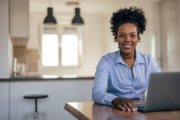 istock Shot of african-american employee, satisfied with work 1353442721