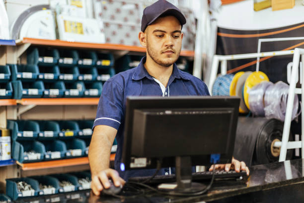 istock Young latin man working in hardware store 1353444466