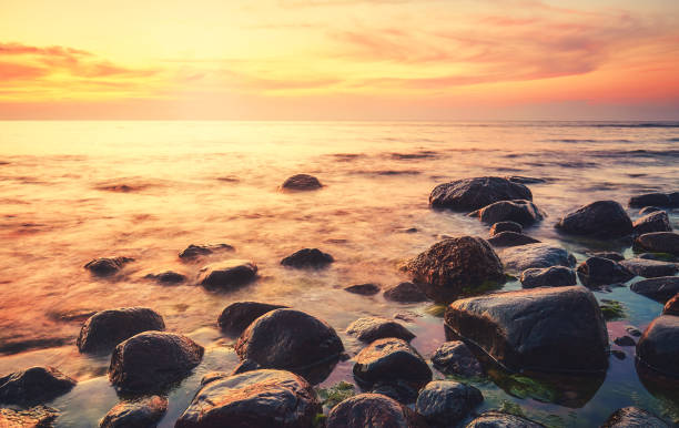 istock Rocky beach at a beautiful sunset. 1353444704