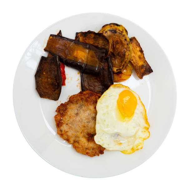 istock Just cooked meat cutlet with fried egg and vegetables 1353444802