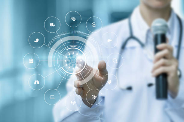 istock A speaking doctor with a microphone in his hands shows on a virtual screen of the effect of the virus on internal organs. 1353444979