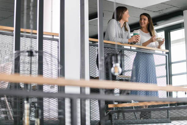 istock Two businesswomen casually chatting on a coffee break 1353446139