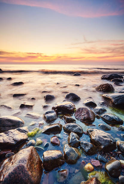 istock Rocky beach at a beautiful sunset. 1353447331
