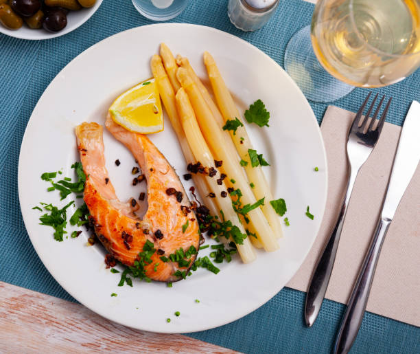 istock Grilled salmon steak with asparagus and lemon 1353448045