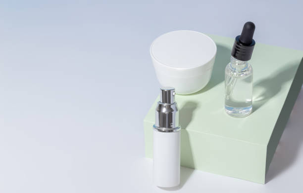 istock White cosmetic jars on a stand. Plastic container for cream, lotion, serum and face mask. The concept of environmentally friendly, organic cosmetology. 1353448237