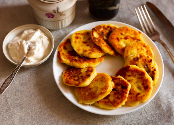 istock Just cooked syrniki on white plate 1353448770