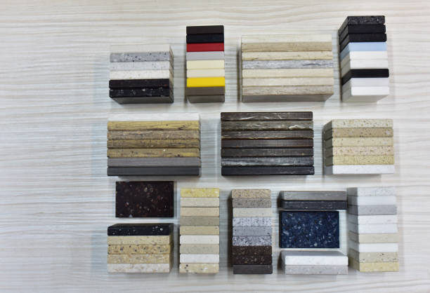 istock Samples of acrylic artificial stone for countertops. 1353449521