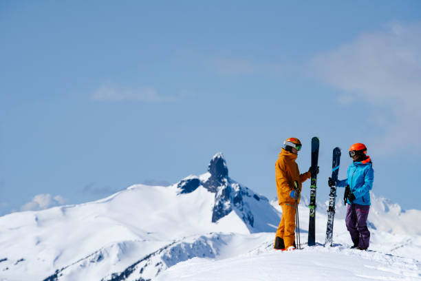 istock Couple skiing in Whistler, Canada 1353450041