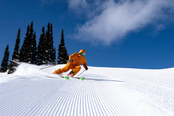 Skier on groomed runs stock photo