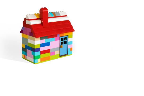 istock Colorful house made with toy from plastic blocks. Space for text. 1353451383