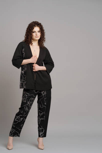 istock Curly woman portrait on gray background 1353452184