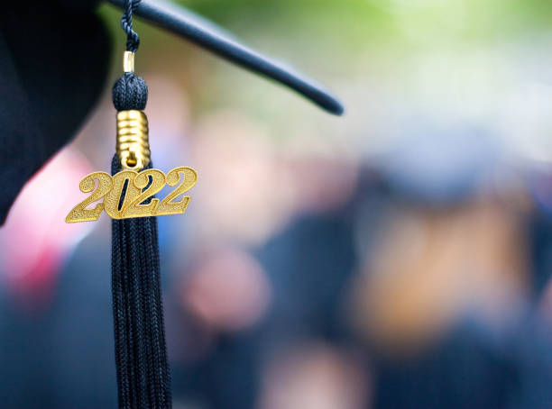 Class of 2022 Graduation Ceremony Tassel Black Closeup of a 2022 Graduation Tassel at a graduation ceremony. graduation cap stock pictures, royalty-free photos & images