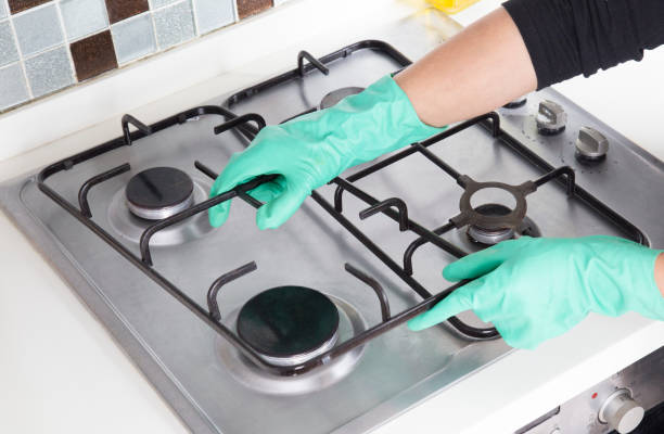 istock woman cleaning the kitchen counter 1353455249