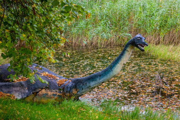 Loch Ness Monster Sculpture in Drumnadrochit, Scotland Loch Ness, Scotland - October 7th 2021: Sculpture of the famous Loch Ness monster, affectionately known as Nessie, in Drumnadrochit in the Highlands of Scotland. drumnadrochit stock pictures, royalty-free photos & images