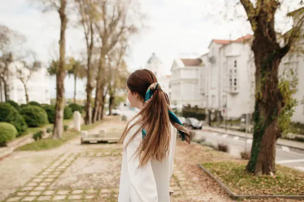 Rear view of a young woman in a city