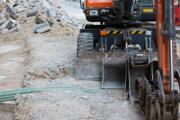 istock Excavator on urban street 1353457796