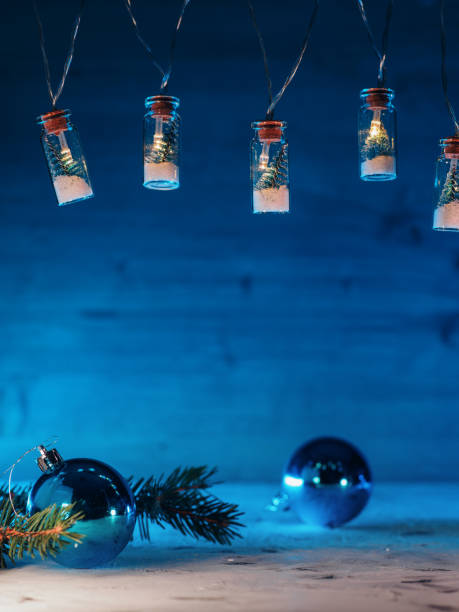 istock Christmas blue background with garland and blue balls, selective focus, copy space 1353458265