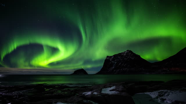 Strong northern lights or Aurora Borealis in Norway