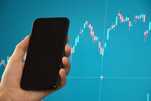 istock Financial data concept. Analyzing cryptocurrency and financial data in the computer monitor with using smart phone 1353458608