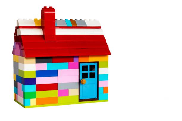 istock Colorful house made with toy from plastic blocks. Space for text. 1353459345