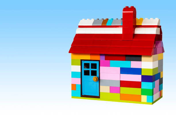 istock Colorful house with blue sky made with docking plastic blocks. 1353459365