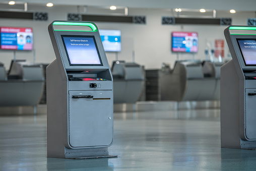 Modern machine for self checking passports and flight reservations at an airport.