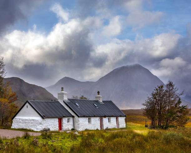Blackrock Cottage with Buachaille Etive Mor in the background, in Glencoe, Scotland Glencoe, Scotland - October 10th 2021: The picturesque view of Blackrock Cottage with Buachaille Etive Mor in the background, in the Glen Etive area of Glencoe in the Scottish Highlands. etive river photos stock pictures, royalty-free photos & images