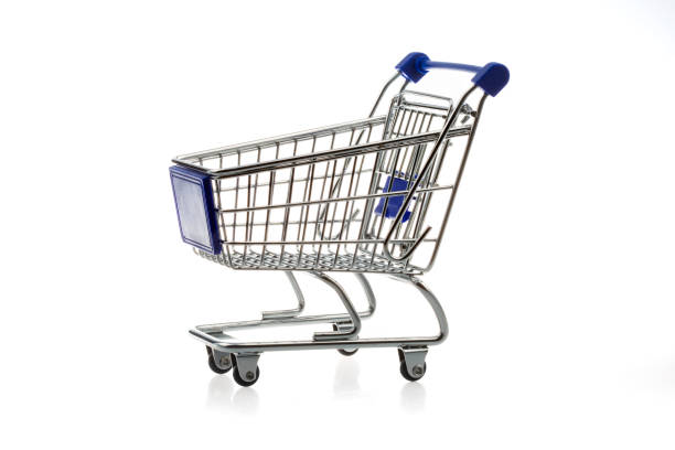 Close up of supermarket grocery push cart for shopping with black wheels and plastic elements on handle isolated on white background. Concept of shopping. Copy space for advertisement. High quality photo