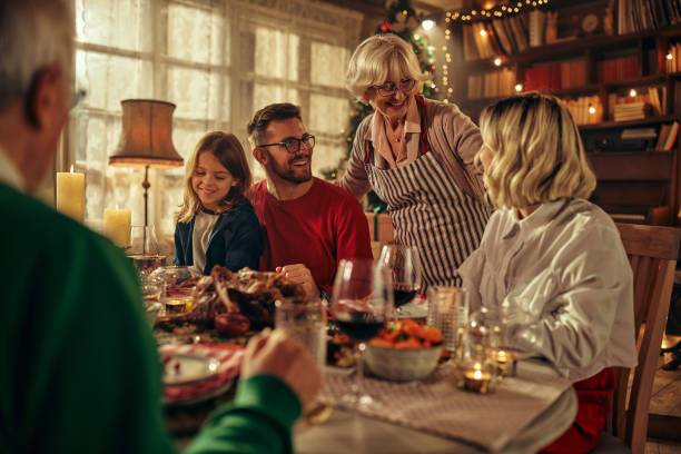 Family having lunch on Christmastime stock photo