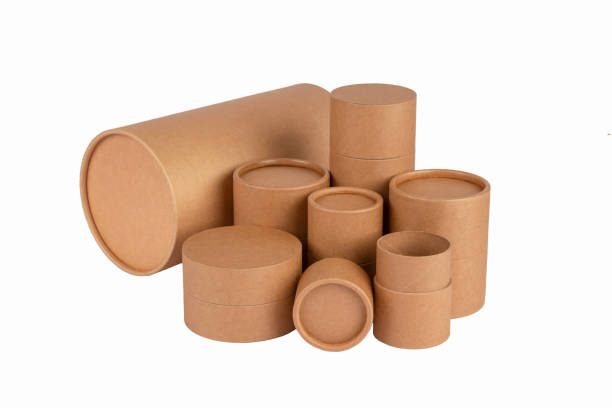 istock Different paper tubes with paper caps or lids, kraft recycle cardboard containers for packaging isolated on white with copy space, mockup. Recyclable and reusable packaging 1353462049