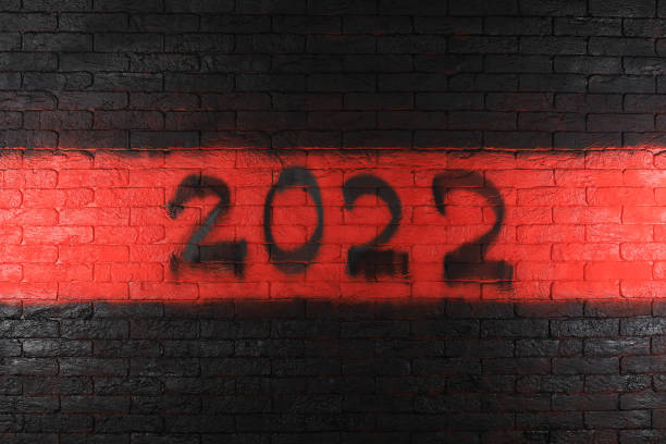 istock black numbers of new year 2022 on red brick wall 1353463785