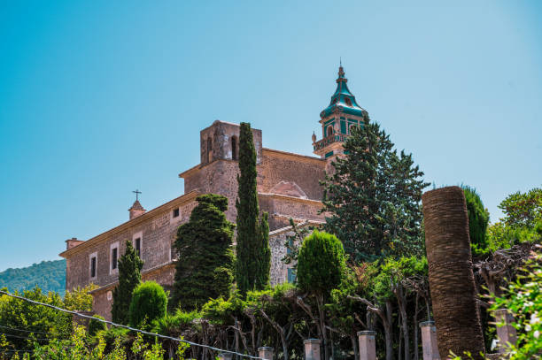istock famous church in Valldemossa, Mallorca against blue summer sky 1353465409